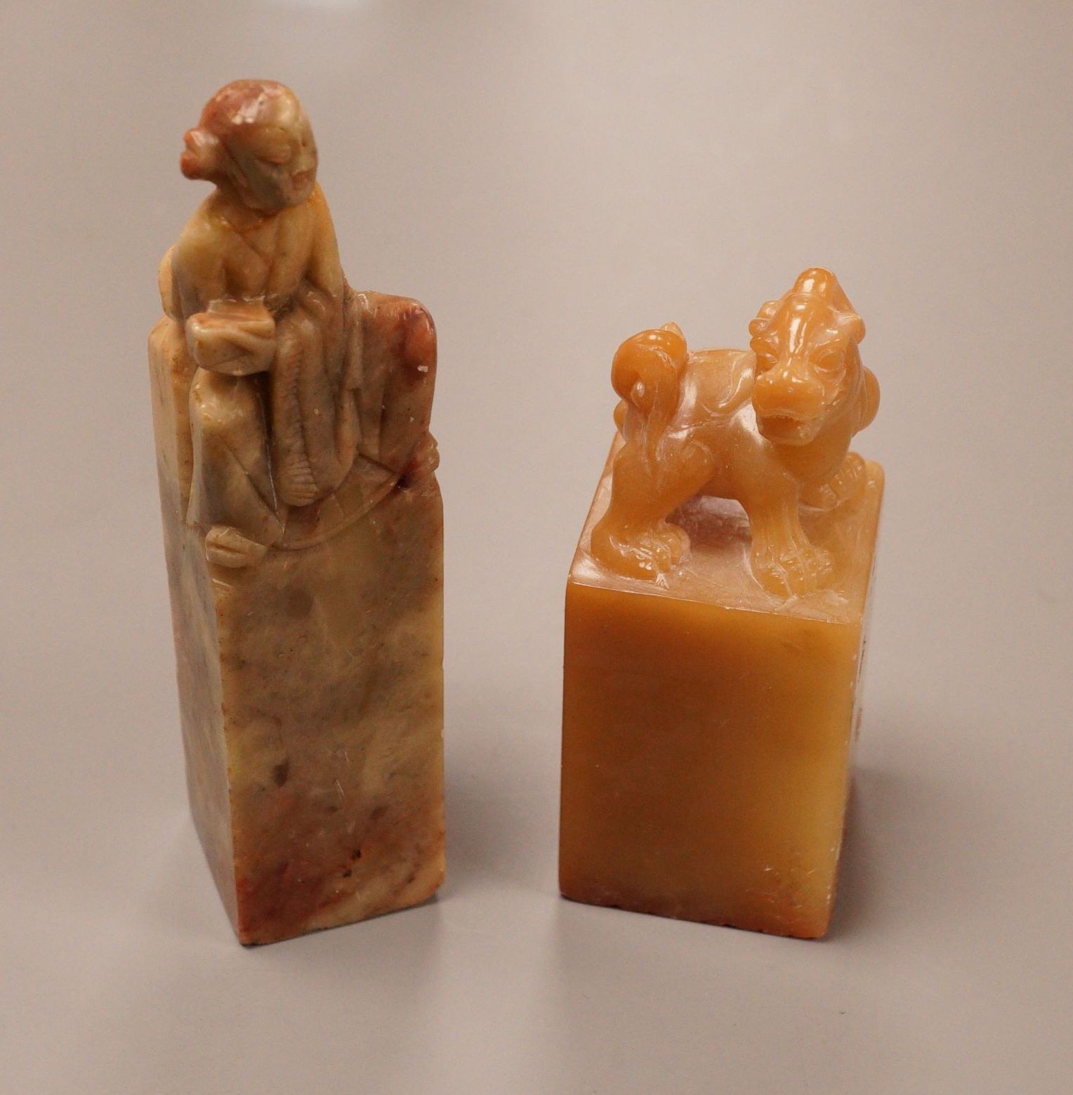 Two Chinese soapstone seals, tallest 10cm